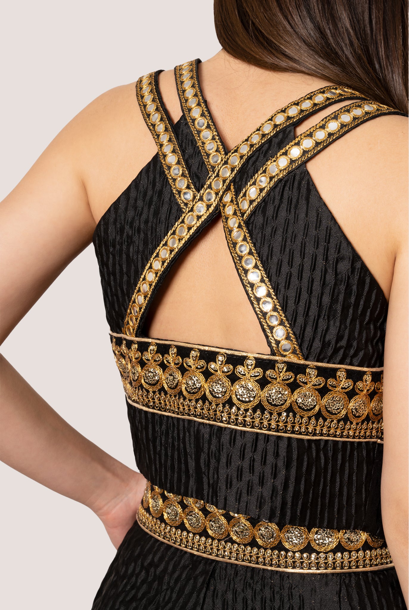 Close-up view of the "Golden Nomad Set" by Tehran Official, showcasing the intricate design details, luxurious jacquard fabric, and meticulous craftsmanship. The image highlights the elegant trims, the quality of the fabric, and the attention to detail that defines this modern and sophisticated black vest and pants set.