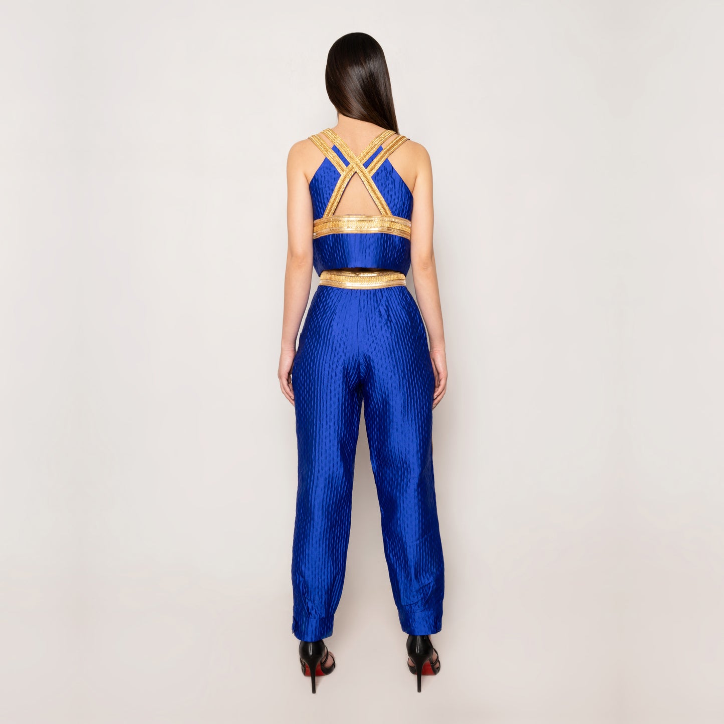 Back view of the Golden Nomad Set in Klein Blue by Tehran, showcasing the luxurious jacquard vest with a keyhole detail and full lining for a structured fit. The ensemble highlights the rich texture and sophisticated design of the fabric.