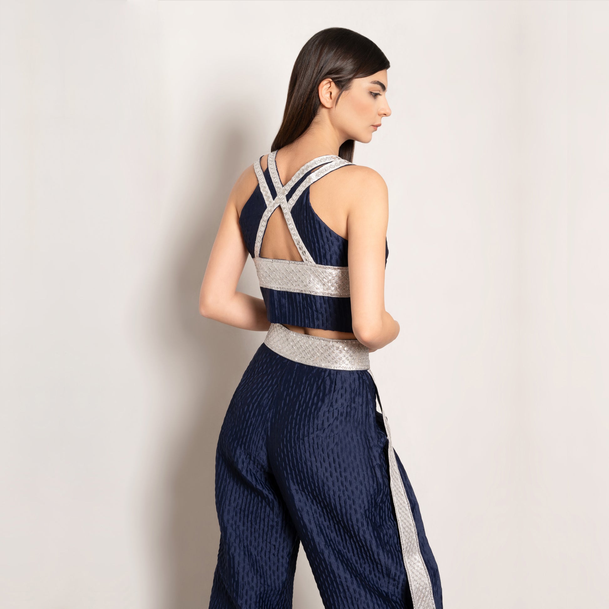 Back view of the Golden Nomad Set in Navy Blue by Tehran, showcasing the luxurious jacquard vest with a keyhole detail and full lining for a structured fit. The ensemble emphasizes intricate design and refined tailoring.